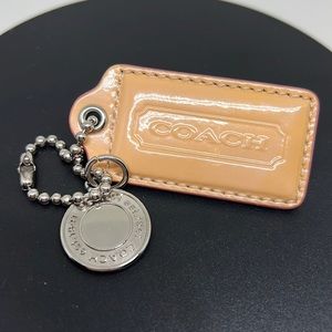 Coach tag and charm